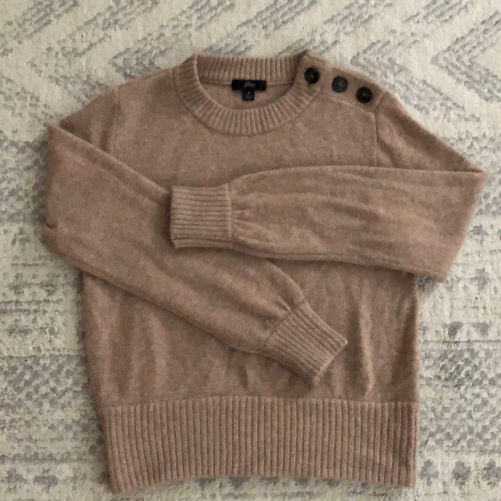 Cropped sweater, button detail at neck.